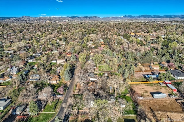 birds eye view of property featuring a mountain view