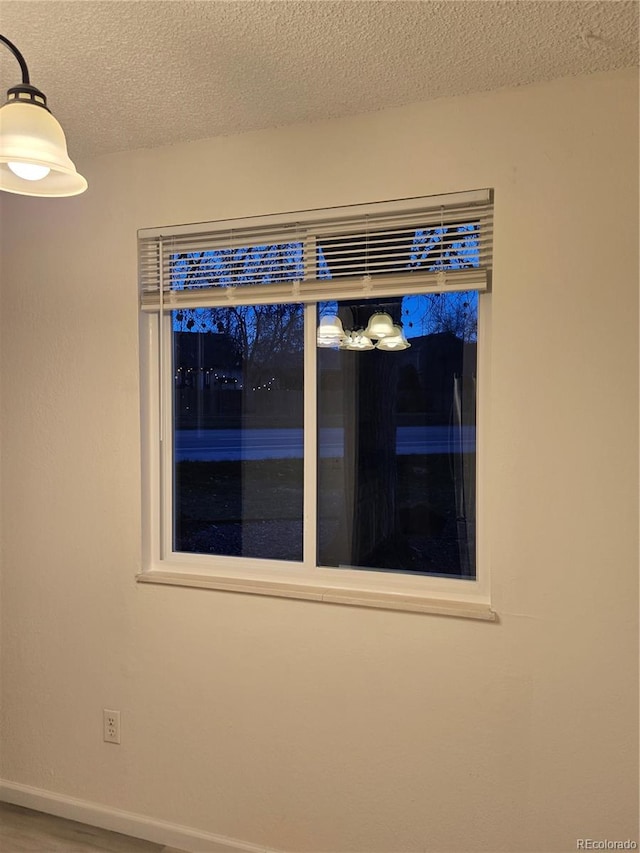 interior details with a textured ceiling