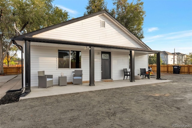 rear view of house with a patio