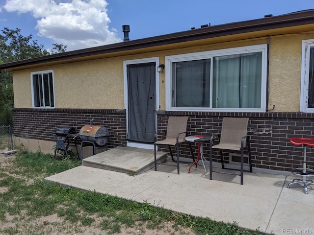 back of property with a patio area