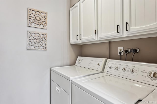 laundry area featuring cabinet space and independent washer and dryer