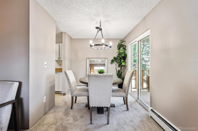 dining area with light carpet, baseboard heating, a chandelier, and a textured ceiling