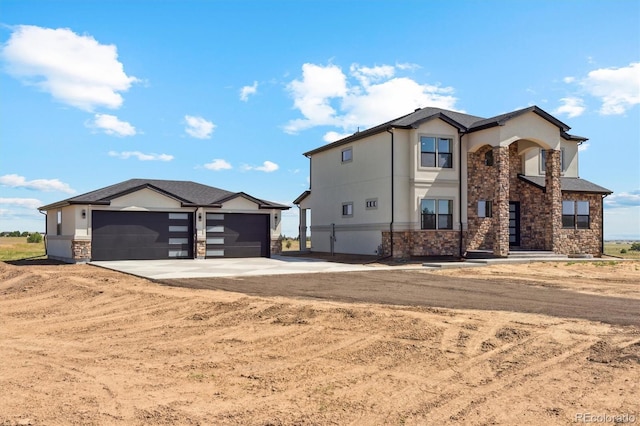 995 Pinehurst Ct, Bennett, CO 80102 - view of front of home featuring stone siding, concrete driveway, stucco siding, and an attached garage