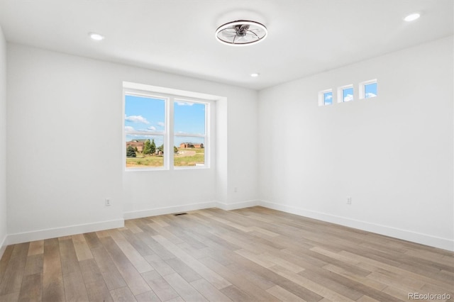 995 Pinehurst Ct, Bennett, CO 80102 - empty room featuring plenty of natural light, light wood finished floors, and recessed lighting