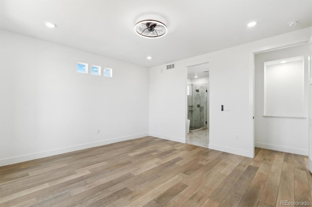 995 Pinehurst Ct, Bennett, CO 80102 - unfurnished bedroom with light wood-type flooring, recessed lighting, and ensuite bathroom