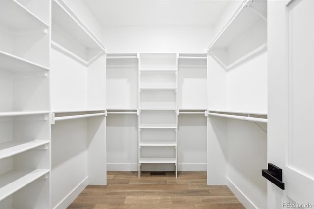 995 Pinehurst Ct, Bennett, CO 80102 - spacious closet with wood finished floors
