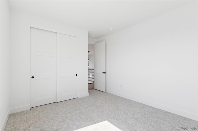 995 Pinehurst Ct, Bennett, CO 80102 - unfurnished bedroom with light colored carpet and a closet