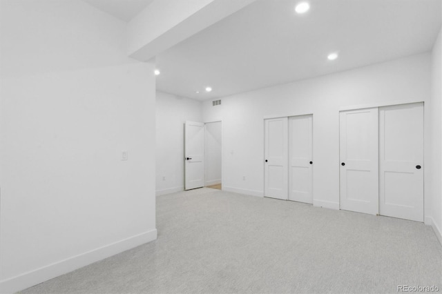 995 Pinehurst Ct, Bennett, CO 80102 - unfurnished bedroom with recessed lighting, multiple closets, and light colored carpet