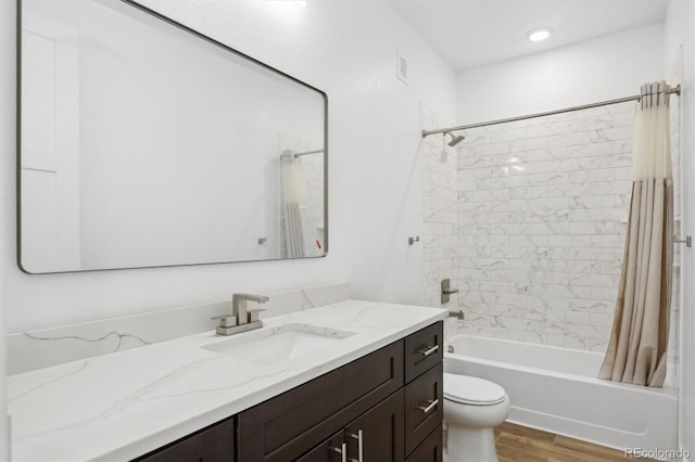 995 Pinehurst Ct, Bennett, CO 80102 - full bath with vanity, shower / bathtub combination with curtain, and wood finished floors