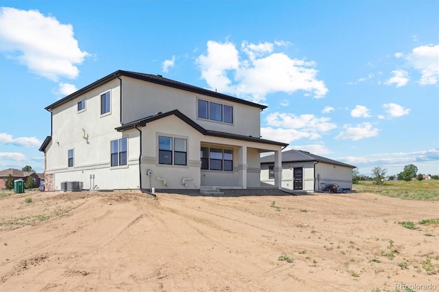 995 Pinehurst Ct, Bennett, CO 80102 - rear view of property with stucco siding