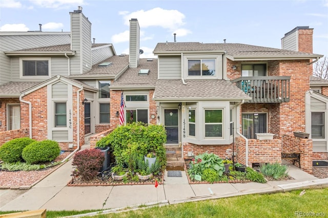 15149 E Princeton Pl Unit B, Aurora, CO 80014 - multi unit property with a balcony, a chimney, roof with shingles, and brick siding