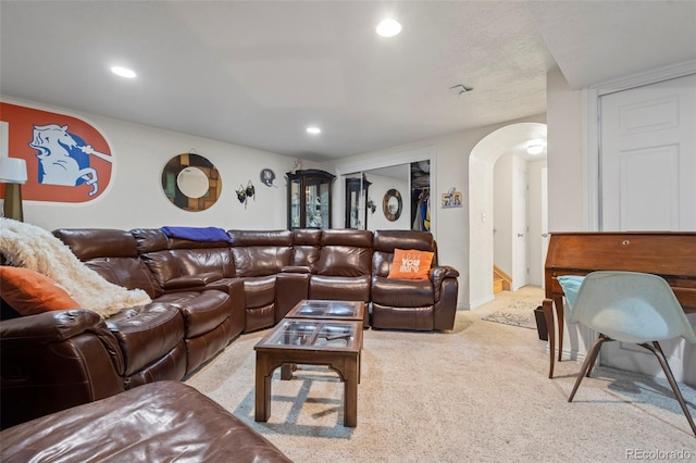 15149 E Princeton Pl Unit B, Aurora, CO 80014 - carpeted living area with arched walkways, recessed lighting, and baseboards