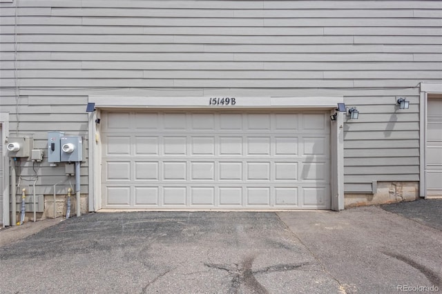 15149 E Princeton Pl Unit B, Aurora, CO 80014 - garage featuring asphalt driveway