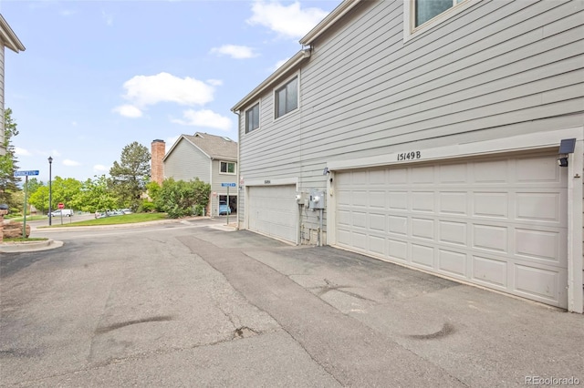 15149 E Princeton Pl Unit B, Aurora, CO 80014 - view of side of home featuring asphalt driveway