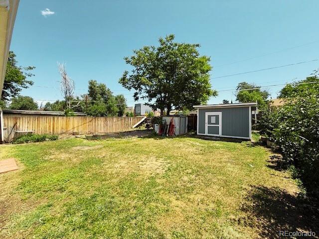 1280 Alton St, Aurora, CO 80010 - view of yard featuring a shed