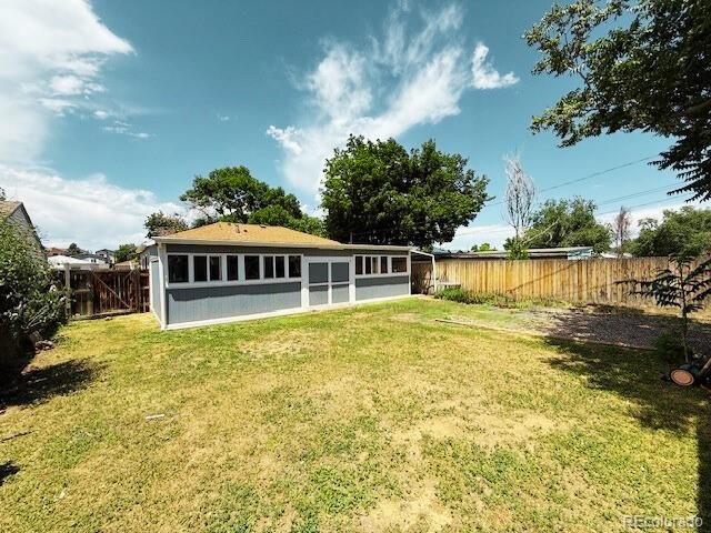 1280 Alton St, Aurora, CO 80010 - rear view of house with a fenced backyard