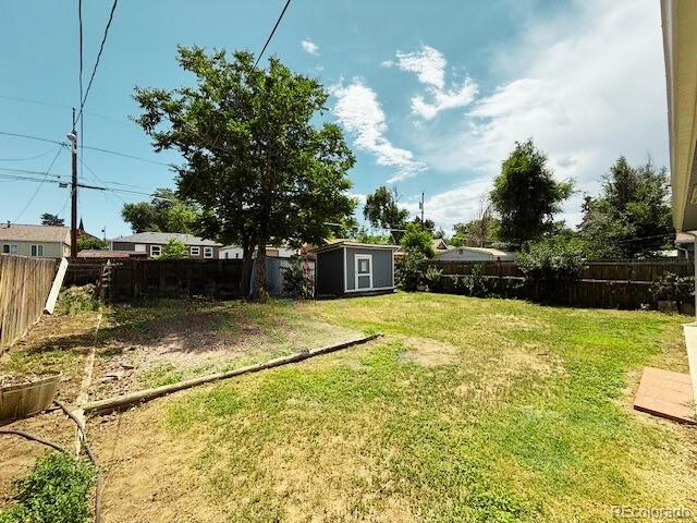 1280 Alton St, Aurora, CO 80010 - fenced backyard with a shed