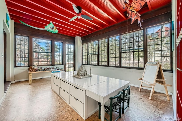 dining area with baseboards and ceiling fan