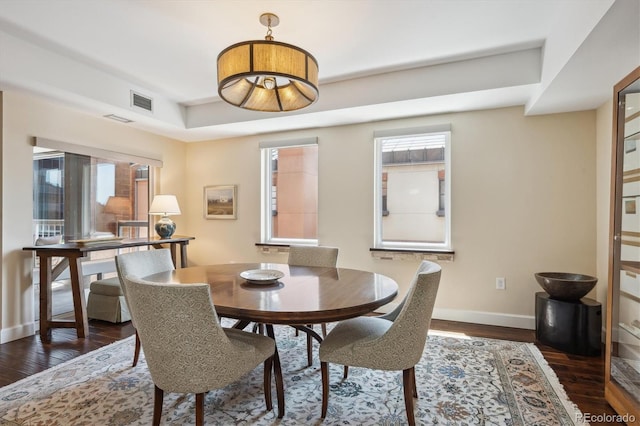1512 Larimer St Unit 39, Denver, CO 80202 - dining space with baseboards and dark wood-style flooring
