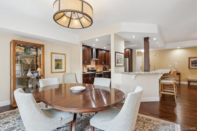 1512 Larimer St Unit 39, Denver, CO 80202 - dining space with dark wood-style flooring, baseboards, and recessed lighting