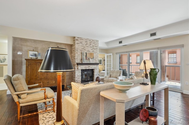 1512 Larimer St Unit 39, Denver, CO 80202 - living room with hardwood / wood-style flooring and a fireplace