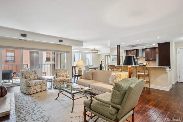 1512 Larimer St Unit 39, Denver, CO 80202 - living room featuring dark wood finished floors, baseboards, and recessed lighting