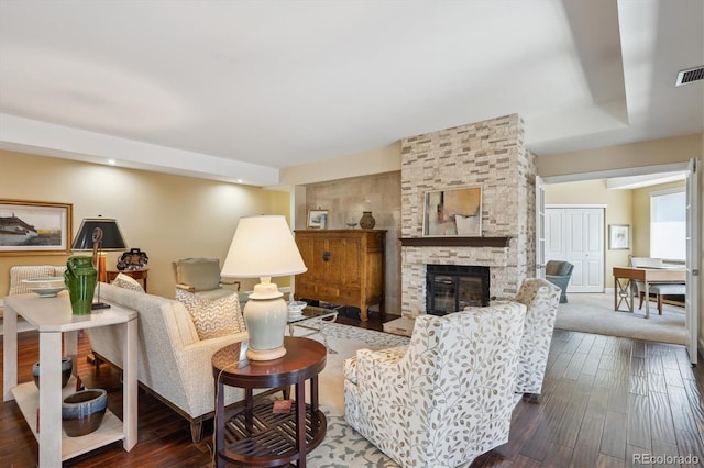 1512 Larimer St Unit 39, Denver, CO 80202 - living room with hardwood / wood-style floors, a stone fireplace, and recessed lighting