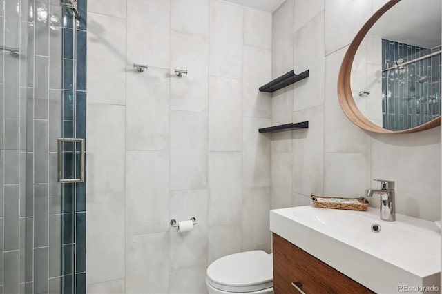 1512 Larimer St Unit 39, Denver, CO 80202 - full bath featuring tile walls, vanity, tiled shower, and toilet