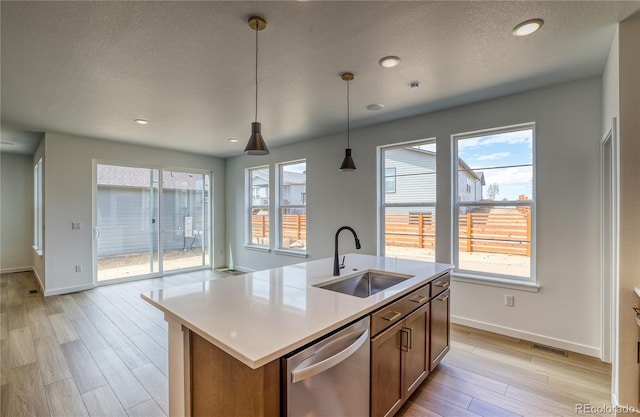 23909 E 41st Ave, Aurora, CO 80019 - kitchen with a sink, dishwasher, baseboards, healthy amount of natural light, and recessed lighting