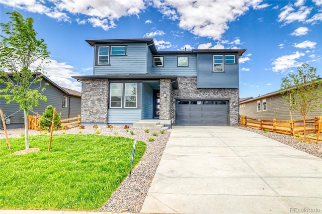 23909 E 41st Ave, Aurora, CO 80019 - view of front of home with stone siding, concrete driveway, and an attached garage