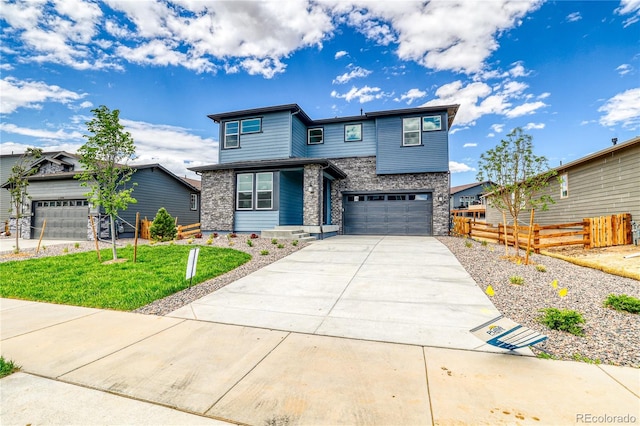 23909 E 41st Ave, Aurora, CO 80019 - view of front of property with stone siding, driveway, and an attached garage