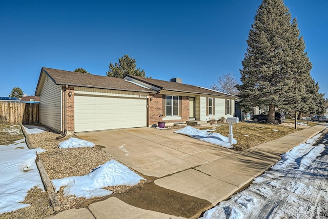 ranch-style home featuring a garage