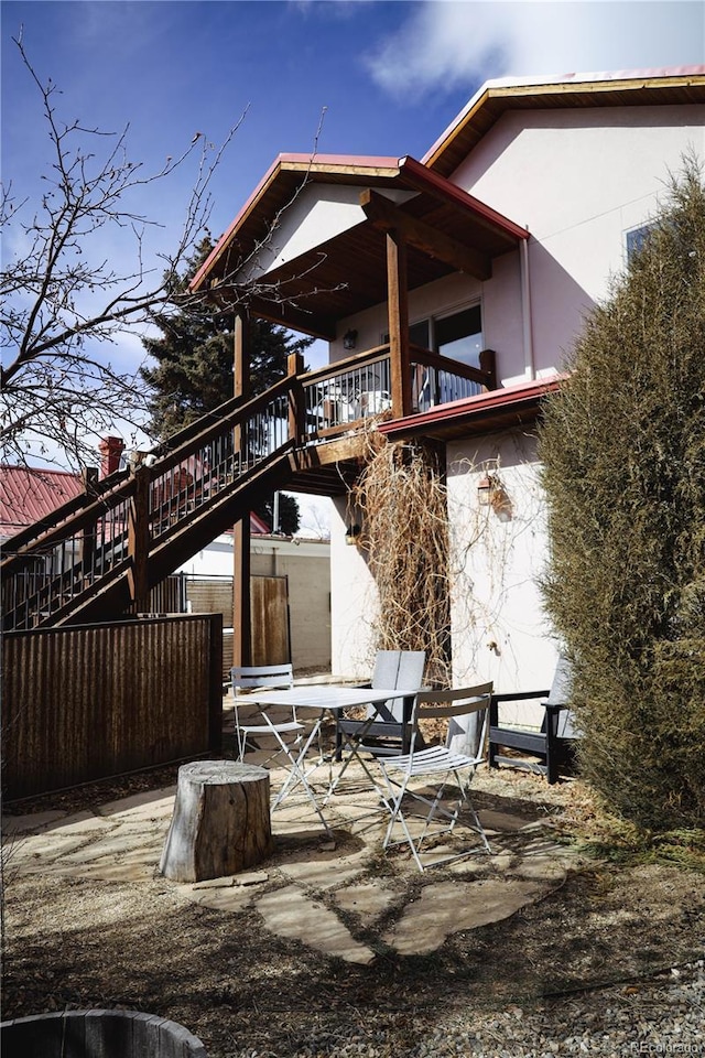 exterior space featuring a deck and stairway