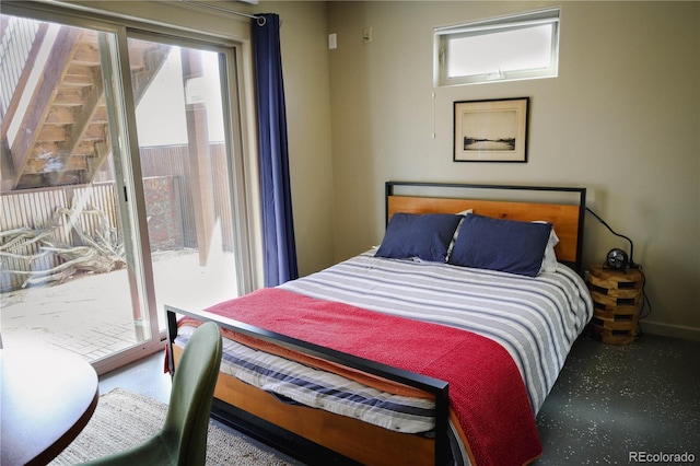 bedroom with access to exterior and multiple windows