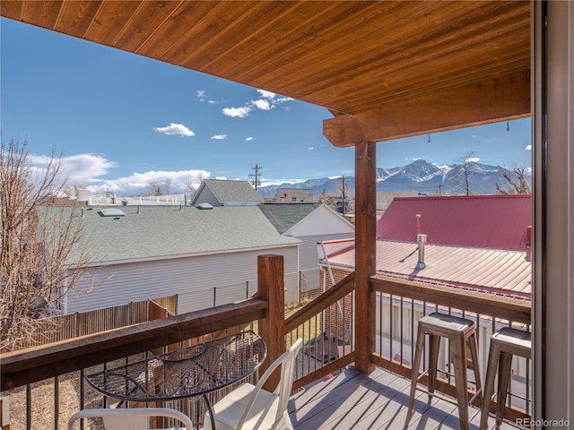 wooden deck with a mountain view