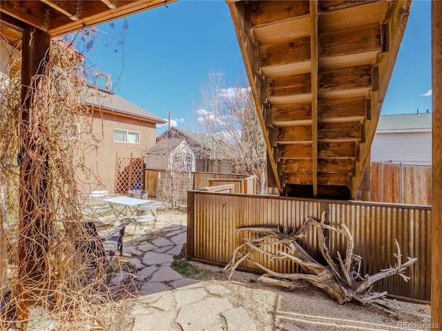 view of patio with fence and outdoor dining area
