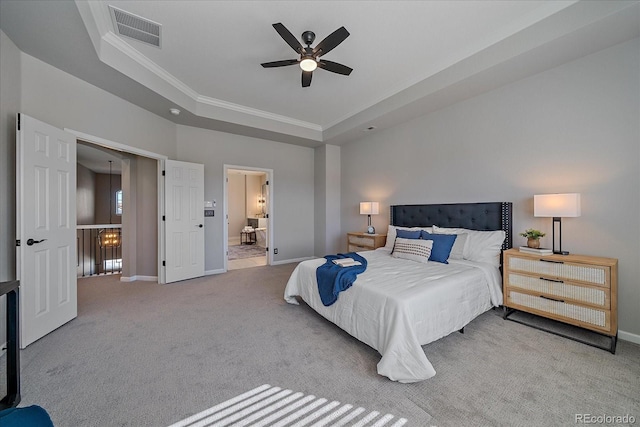 bedroom featuring visible vents, baseboards, a raised ceiling, and carpet