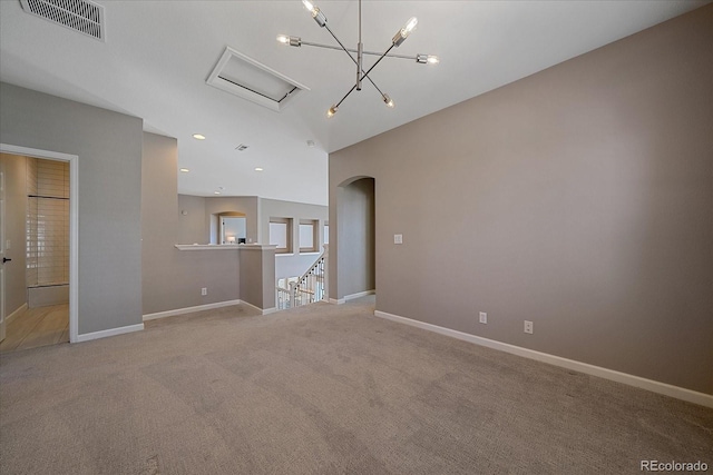 unfurnished living room with visible vents, baseboards, carpet floors, recessed lighting, and arched walkways