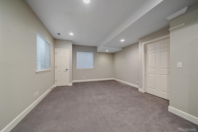 interior space with visible vents, recessed lighting, baseboards, and dark colored carpet