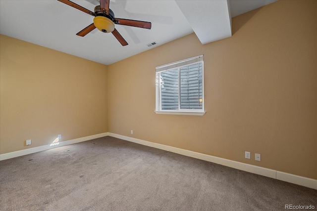 empty room featuring a ceiling fan, carpet, visible vents, and baseboards