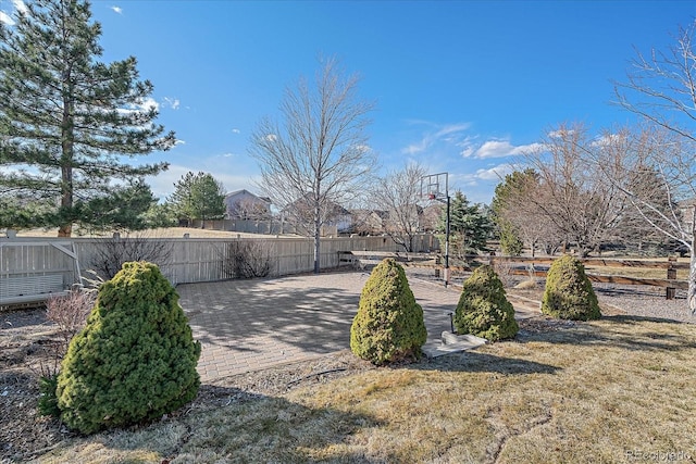 view of yard featuring a patio and fence