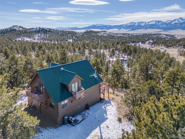 bird's eye view featuring a wooded view and a mountain view