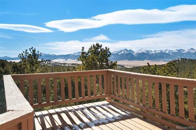 wooden terrace featuring a mountain view