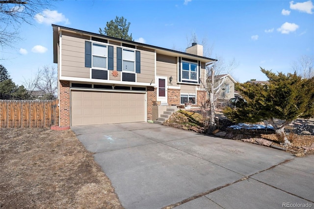 bi-level home featuring a garage