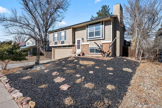 raised ranch featuring a garage