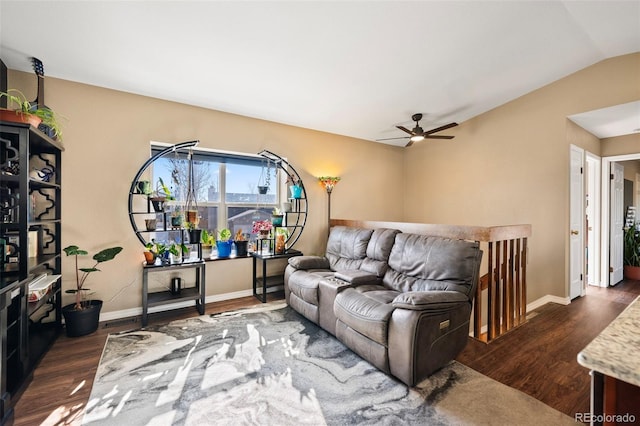 living room featuring ceiling fan, lofted ceiling, and dark hardwood / wood-style flooring