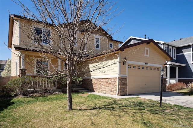 6370 Twilight Ave, Firestone, CO 80504 - view of front of home with concrete driveway, a front lawn, a garage, and stone siding
