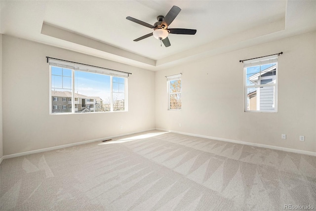 6370 Twilight Ave, Firestone, CO 80504 - carpeted spare room with a raised ceiling, baseboards, and plenty of natural light