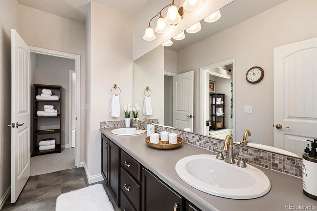 6370 Twilight Ave, Firestone, CO 80504 - bathroom featuring double vanity, tile patterned floors, and baseboards