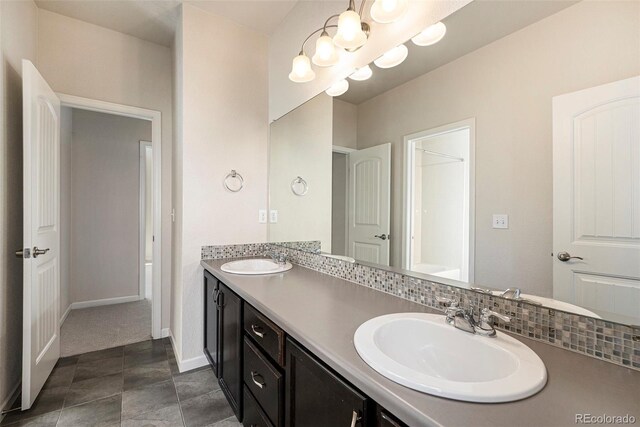 6370 Twilight Ave, Firestone, CO 80504 - full bathroom with double vanity, a chandelier, and baseboards